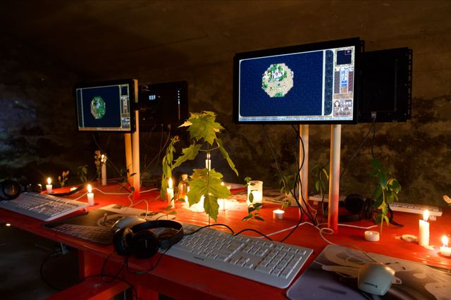 Heroes of Might and Magic III fills two screens above white keyboards, headphones, candles and leafy branches.