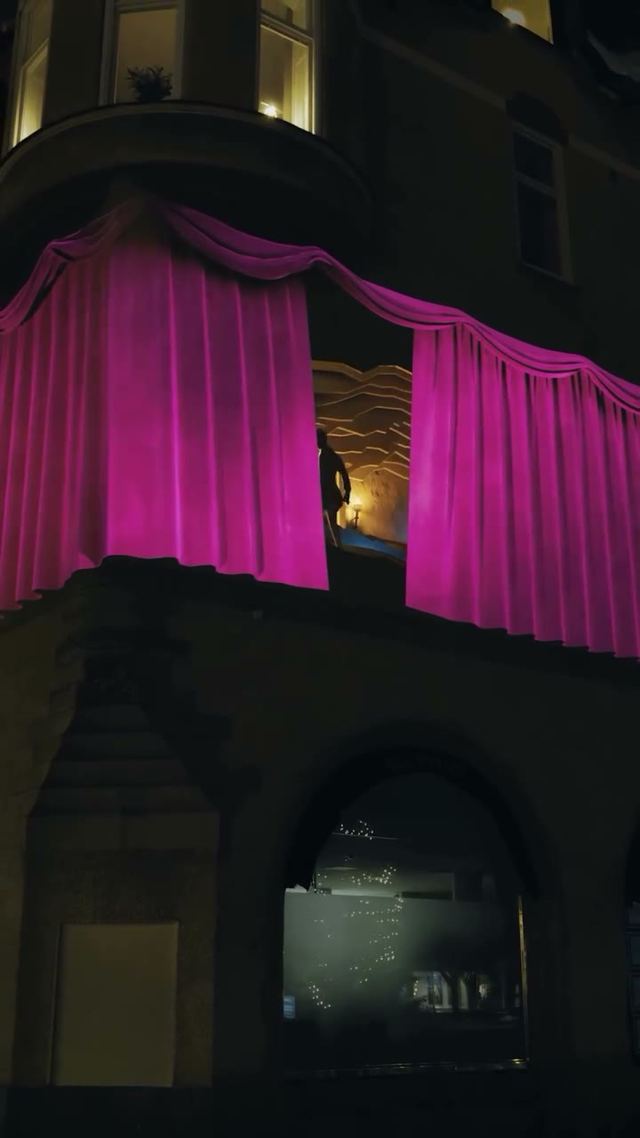 Animated projections transform the curved facade for Sala’s 400-year celebration.